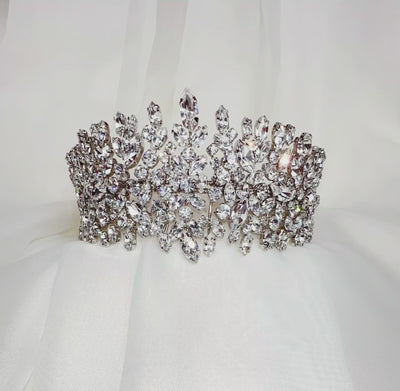 pointed bridal crown made up of round cut sparkling crystal clusters with silver link details