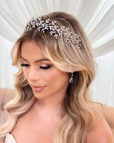 female model wearing silver bridal headband with floral crystal sprigs