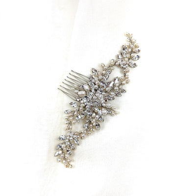 looping silver bridal hair comb with small sprays of round crystals and pearl detailing