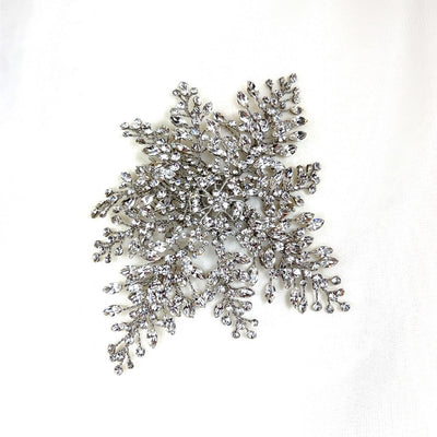 bridal hair comb with silver floral detailing and dramatic crystal sprays