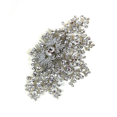 silver bridal hair comb with single crystal center, clusters and sprigs of round crystals