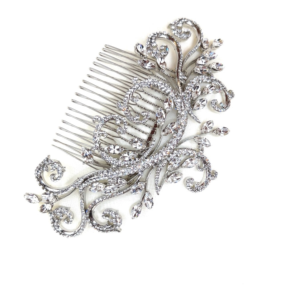 The Crystal Swirl Comb, style no. 242370, is an intricate Pearl and Swarovski crystal bridal hair comb composed of intricate swirling patterns