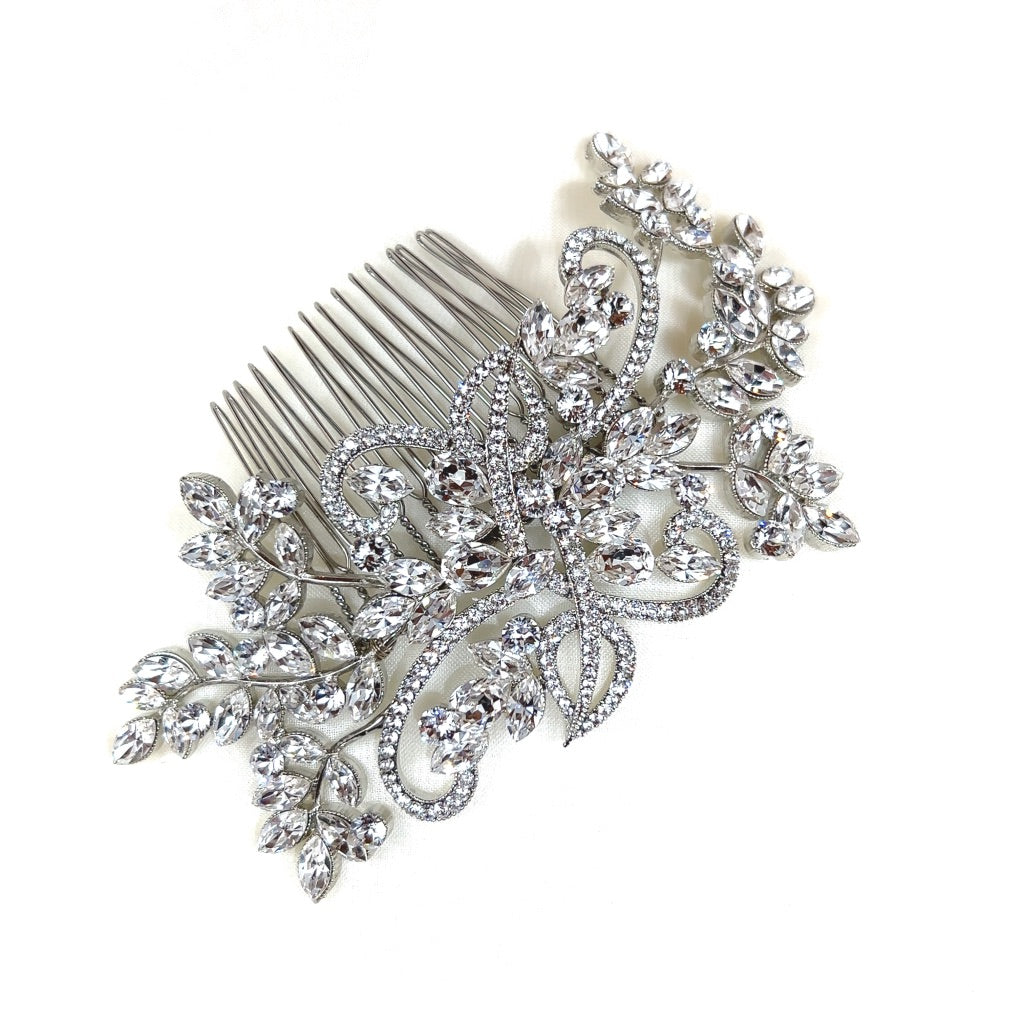 The Flowing Crystal Branch Comb, style no. 242322, features intricate floral and leaf designs embellished with sparkling rhinestones on a decorative silver hair comb, reminiscent of a Swarovski bridal tiara, against a plain white background.