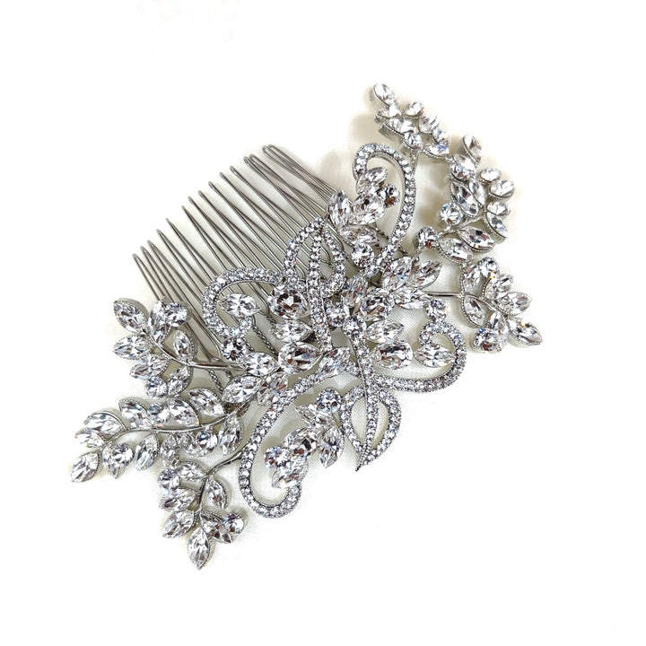 The Flowing Crystal Branch Comb, style no. 242322, features intricate floral and leaf designs embellished with sparkling rhinestones on a decorative silver hair comb, reminiscent of a Swarovski bridal tiara, against a plain white background.