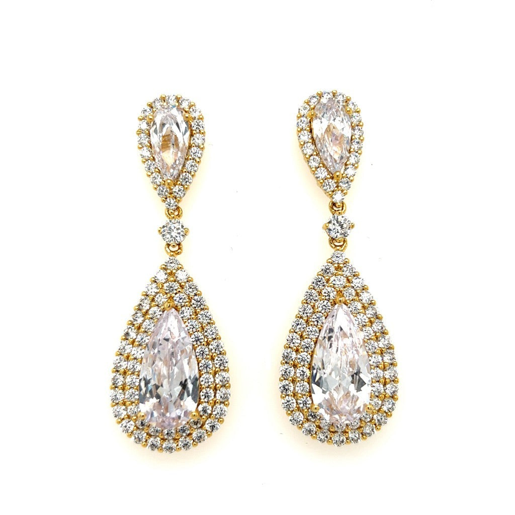 The Glamorous Gold CZ Dangle Wedding Earrings (style no. E189) feature large pear-shaped cubic zirconia framed by two diamond-like rows, creating elegant teardrop bridal earrings with a luxurious gold design.