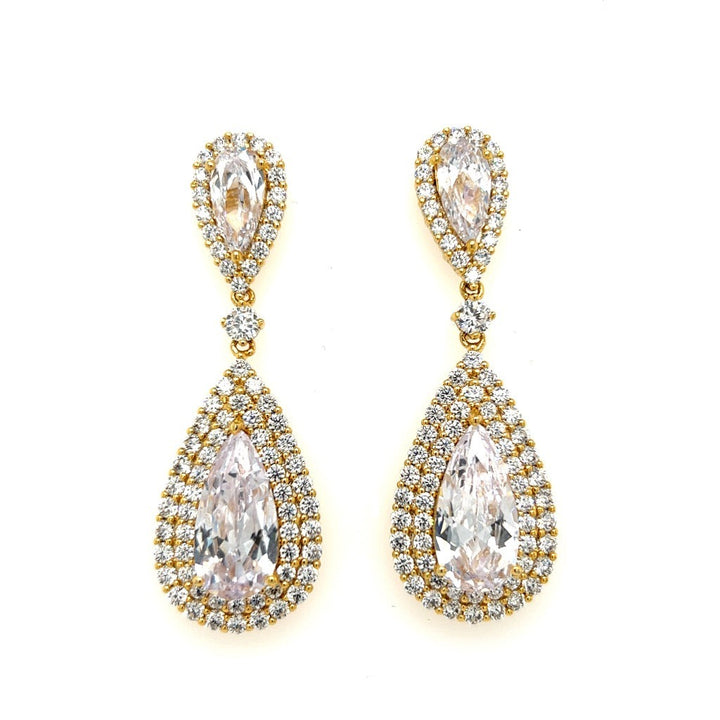 The Glamorous Gold CZ Dangle Wedding Earrings (style no. E189) feature large pear-shaped cubic zirconia framed by two diamond-like rows, creating elegant teardrop bridal earrings with a luxurious gold design.