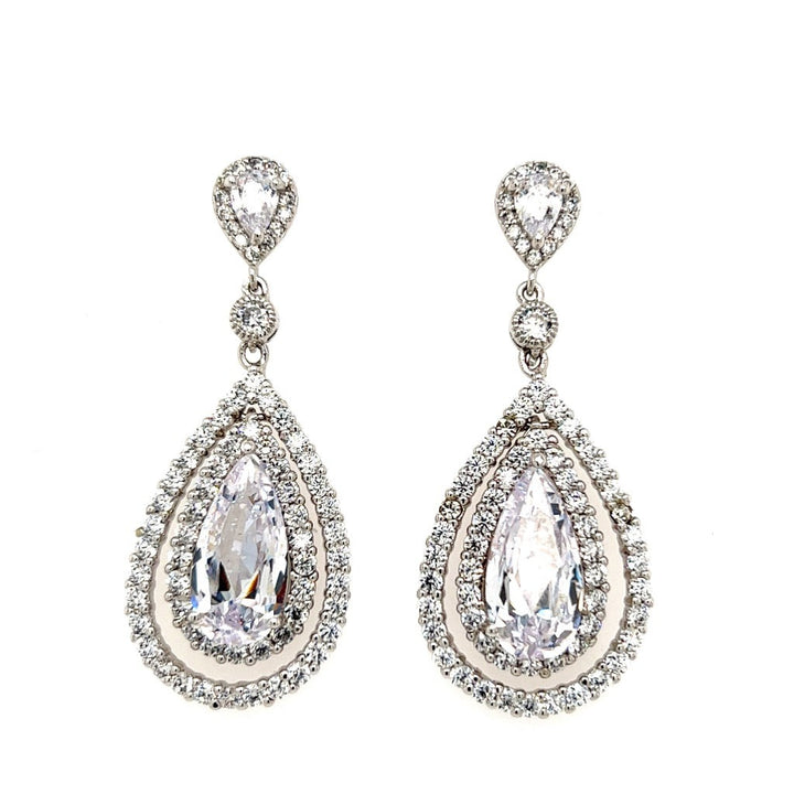 The Hollywood Glam Drop Earrings (style no. E205) feature large clear gemstones surrounded by sparkling stones and a smaller teardrop design—an elegant choice for wedding jewelry on your special day.