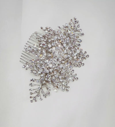 silver bridal hair comb with various sprigs of sparkling crystals