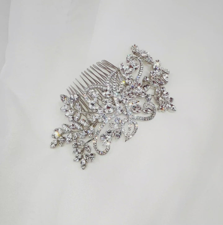 bridal hair comb with curved silver branches and sprigs of various sparkling crystals