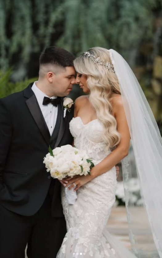 Bride wearing side swept Hollywood waves wedding hair with crystal bridal headband and cathedral veil - elegant bridal hairstyle inspiration