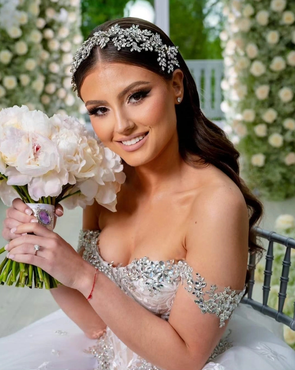 Beautiful bride with long dark hair wearing a Swarovski crystal headpiece by Bridal Styles Boutique 