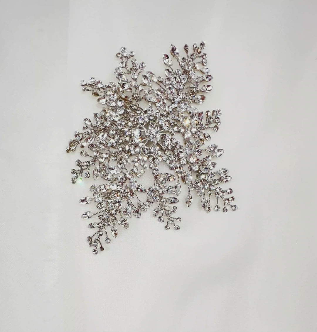 bridal hair comb with silver floral detailing and sparkling crystal sprays