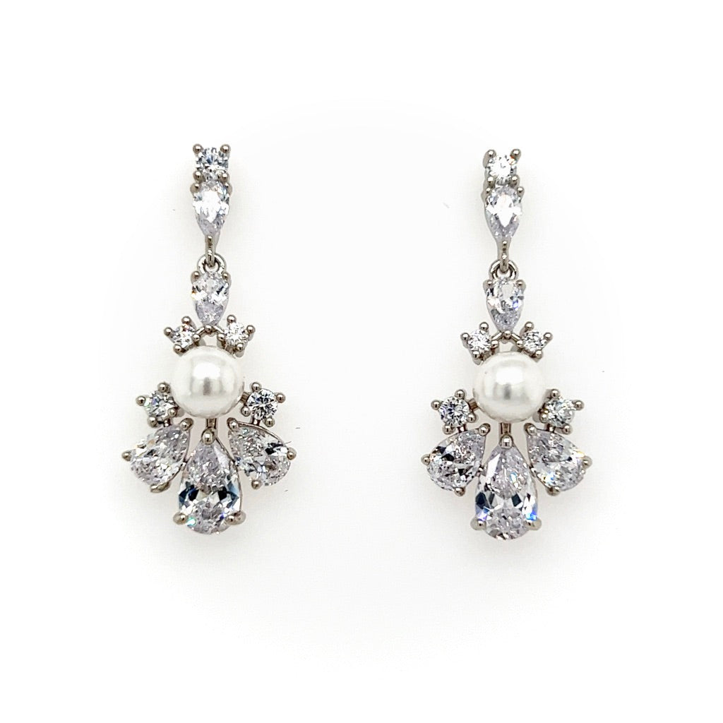 The Exquisite Pearl and CZ Wedding Drop Earrings (style no. E211) feature a central pearl accented by teardrop cubic zirconia in a silver setting, creating a sparkling, floral-inspired bridal look.