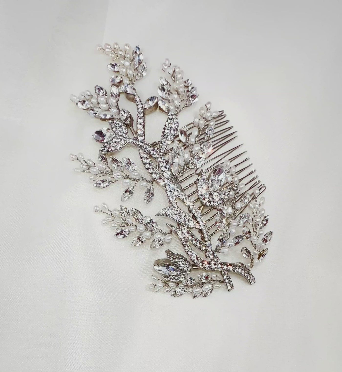 silver bridal hair comb with crystalized branches and sprigs of sparkling crystal and pearl