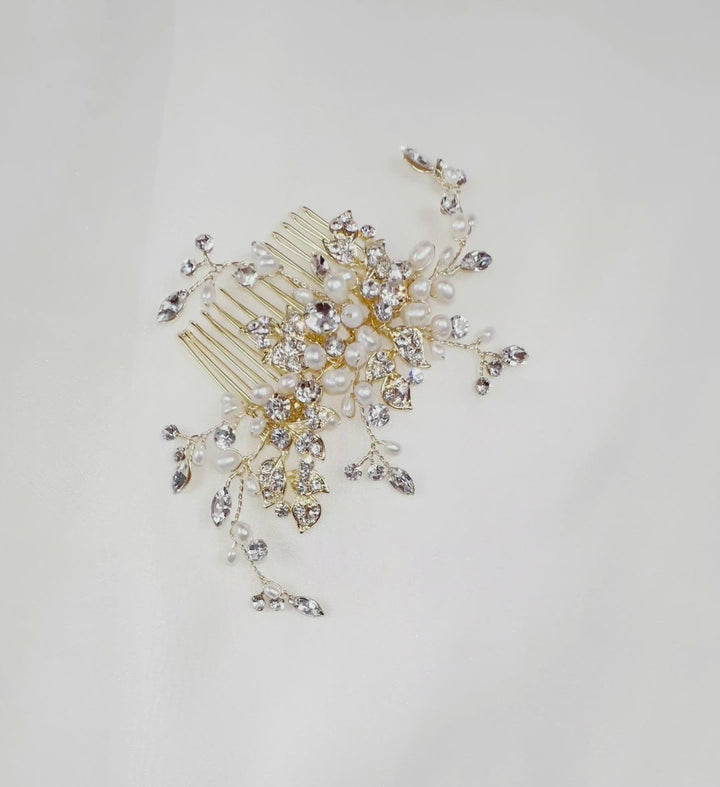 gold bridal hair comb with small sparkling leaves and curved sprigs of crystal and pearl