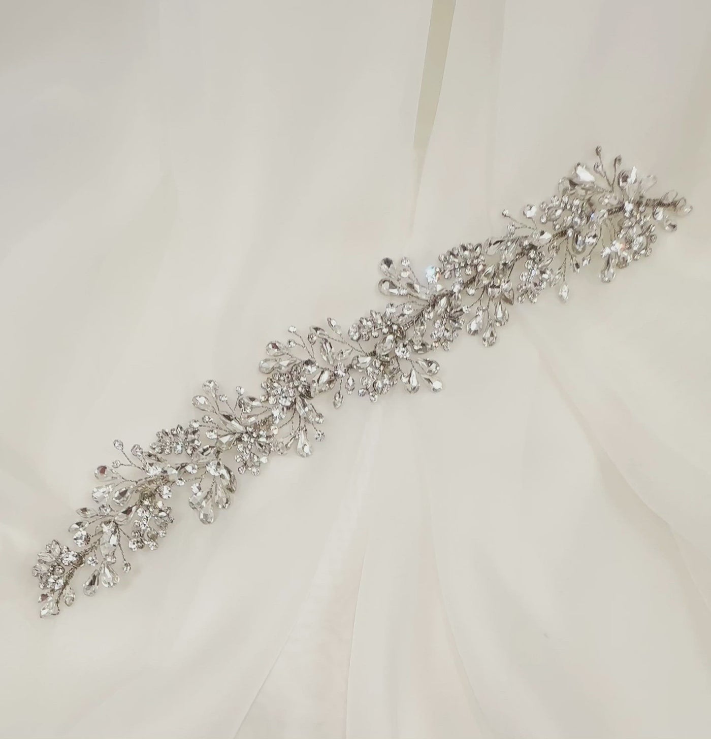 silver bridal hair vine with sprays of flat teardrop crystals