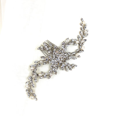 silver looping bridal hair comb with small curved sprigs of crystals and pearl detailing