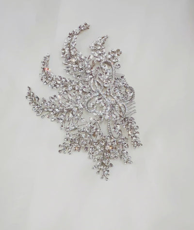 bridal hair comb with swirling silver details and various sweeping crystal sprays.