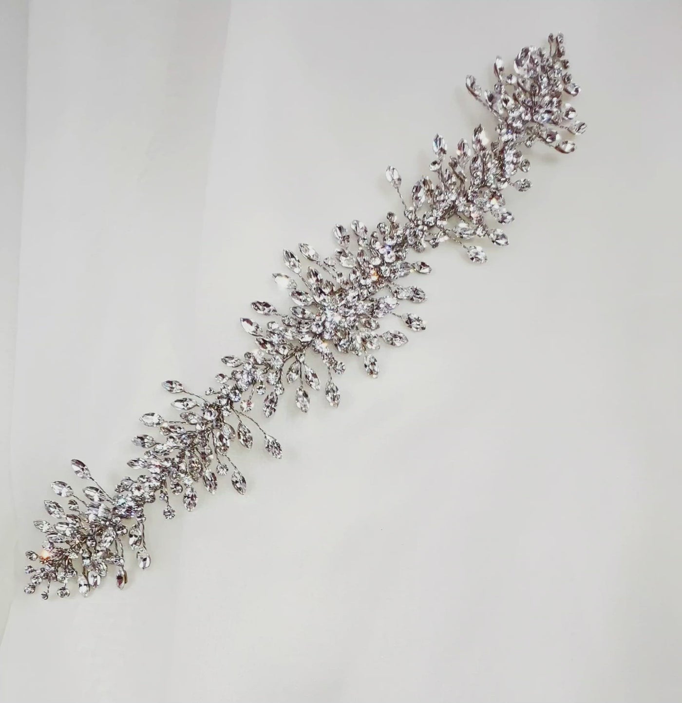 silver bridal hair vine with short sprigs of sparkling teardrop crystals
