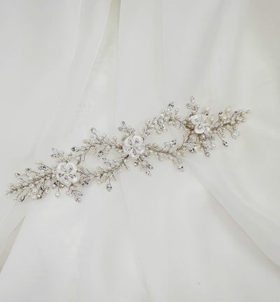 double looping pearl bridal hair vine with white porcelain flowers and small sprigs of crystal