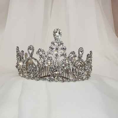 silver bridal tiara with swirling shape, sparkling crystal detailing, and added comb