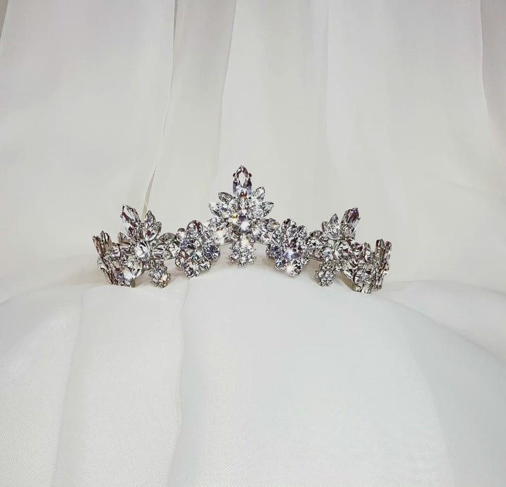 curved silver bridal tiara of sparkling floral crystal clusters