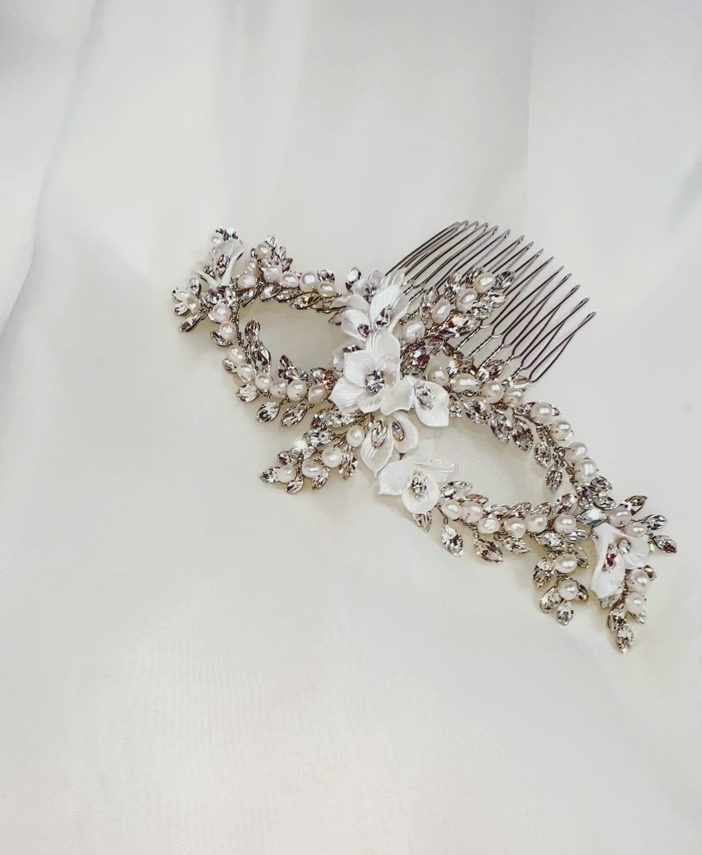 swirling double loop crystal bridal hair vine with pearl and porcelain flower details