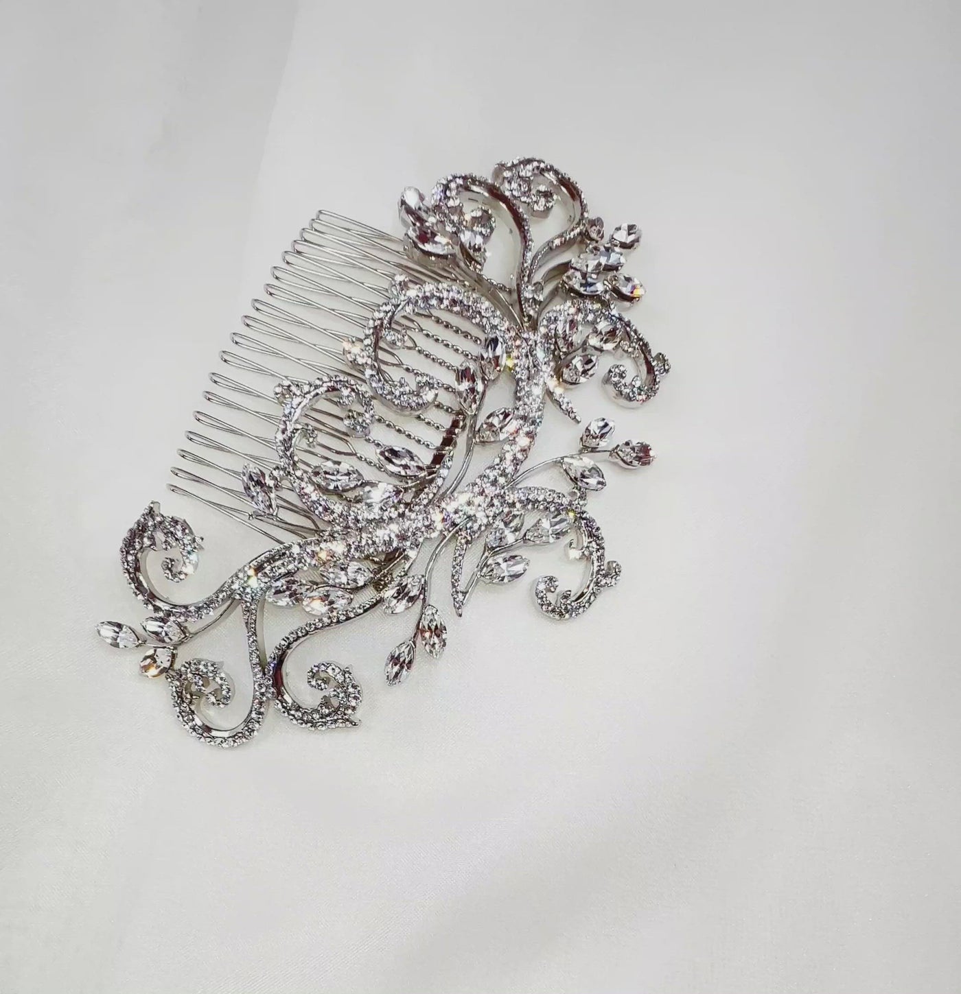 bridal hair comb with silver branching details and small sprigs of crystal