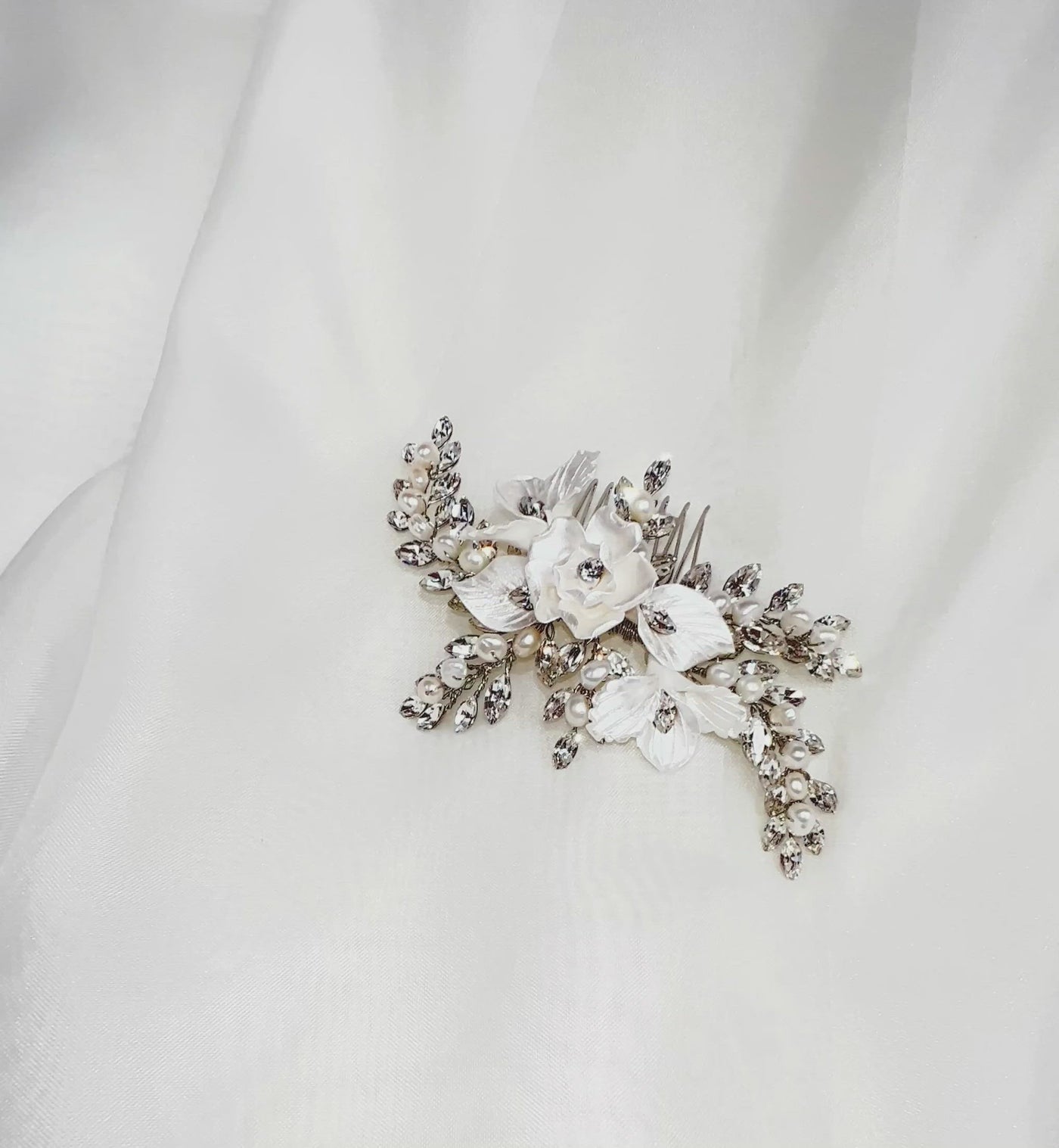porcelain flower bridal hair comb with curved sprigs of crystal and pearl 