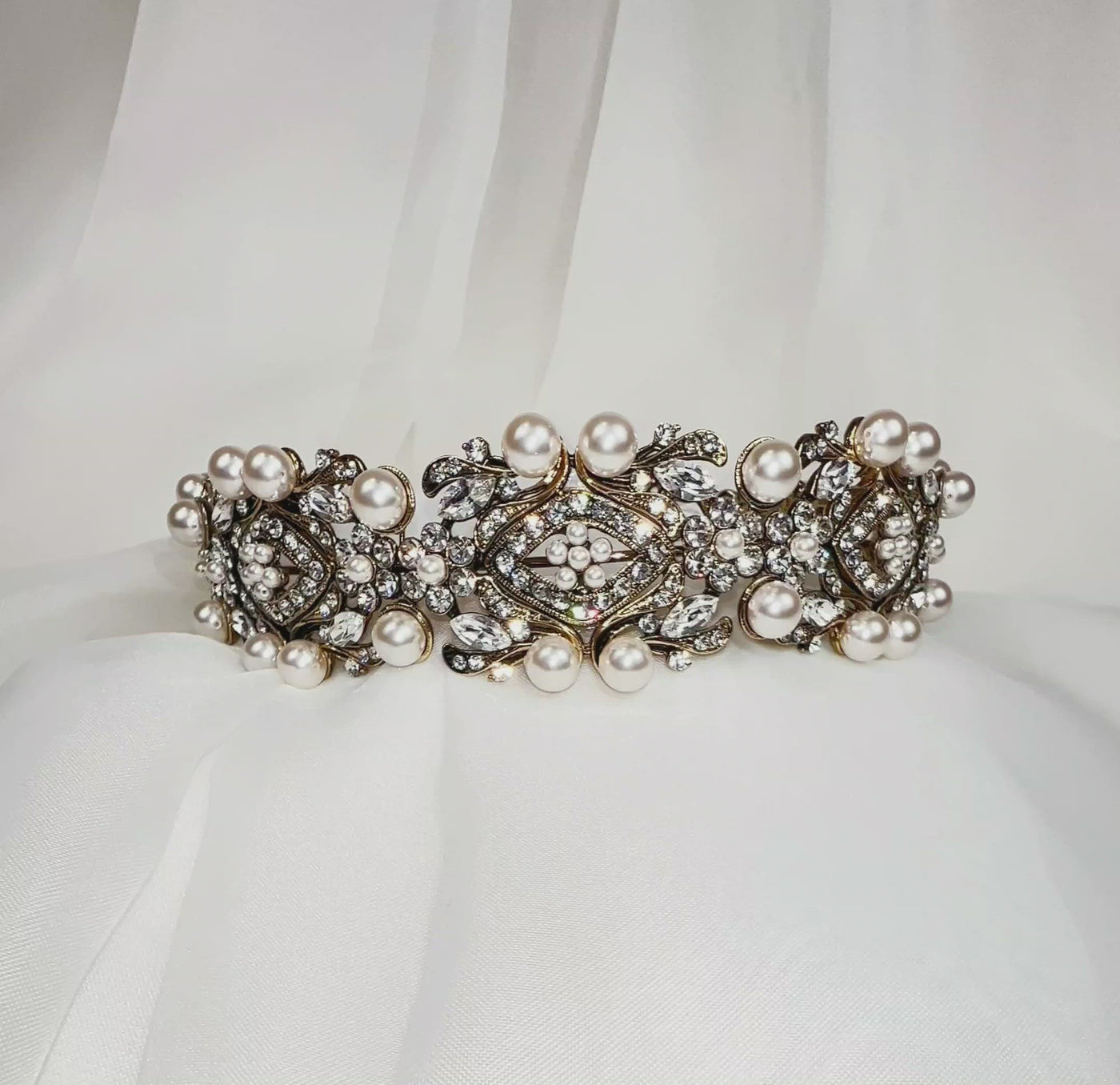 bridal headband with antique gold swirling and floral detailing surrounding sparkling, round crystals and large pearls