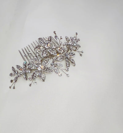silver bridal hair comb with crystalized flowers and small sprigs of sparkling crystals