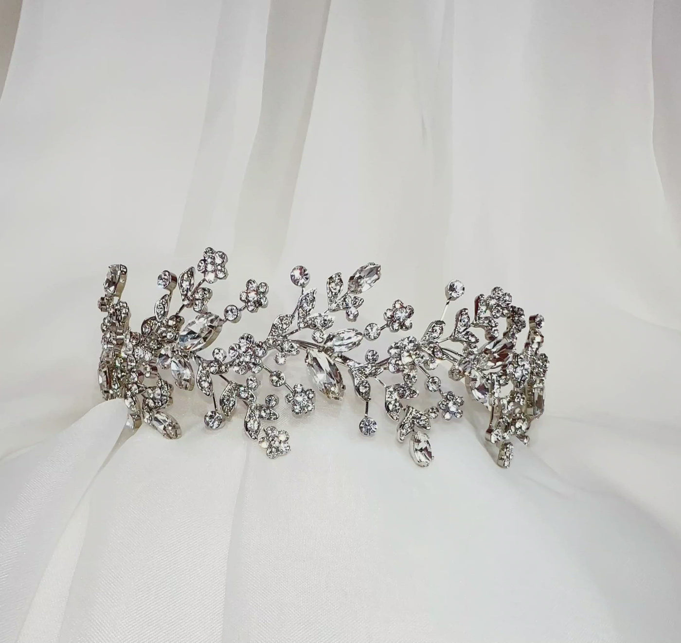 silver bridal headband with sparkling sprigs of floral crystal details