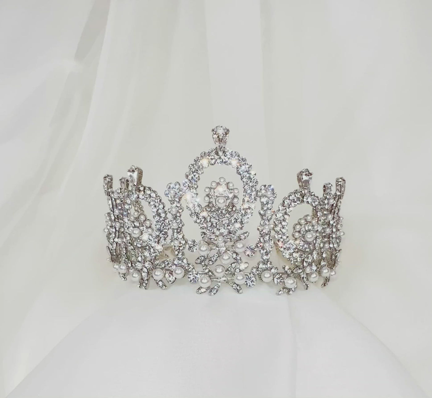 silver bridal crown with sparkling crystal halos and pearl details.