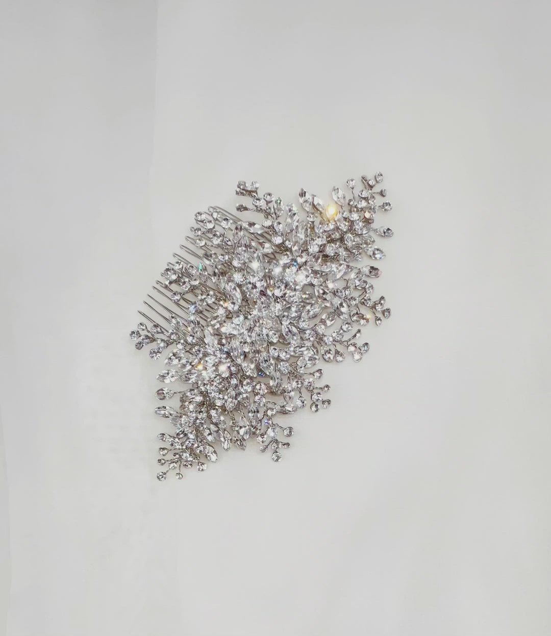 silver bridal hair comb with round cut sprays of crystal