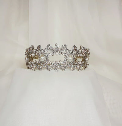 crystal bridal headband with looping silver detailing and large pearl accents