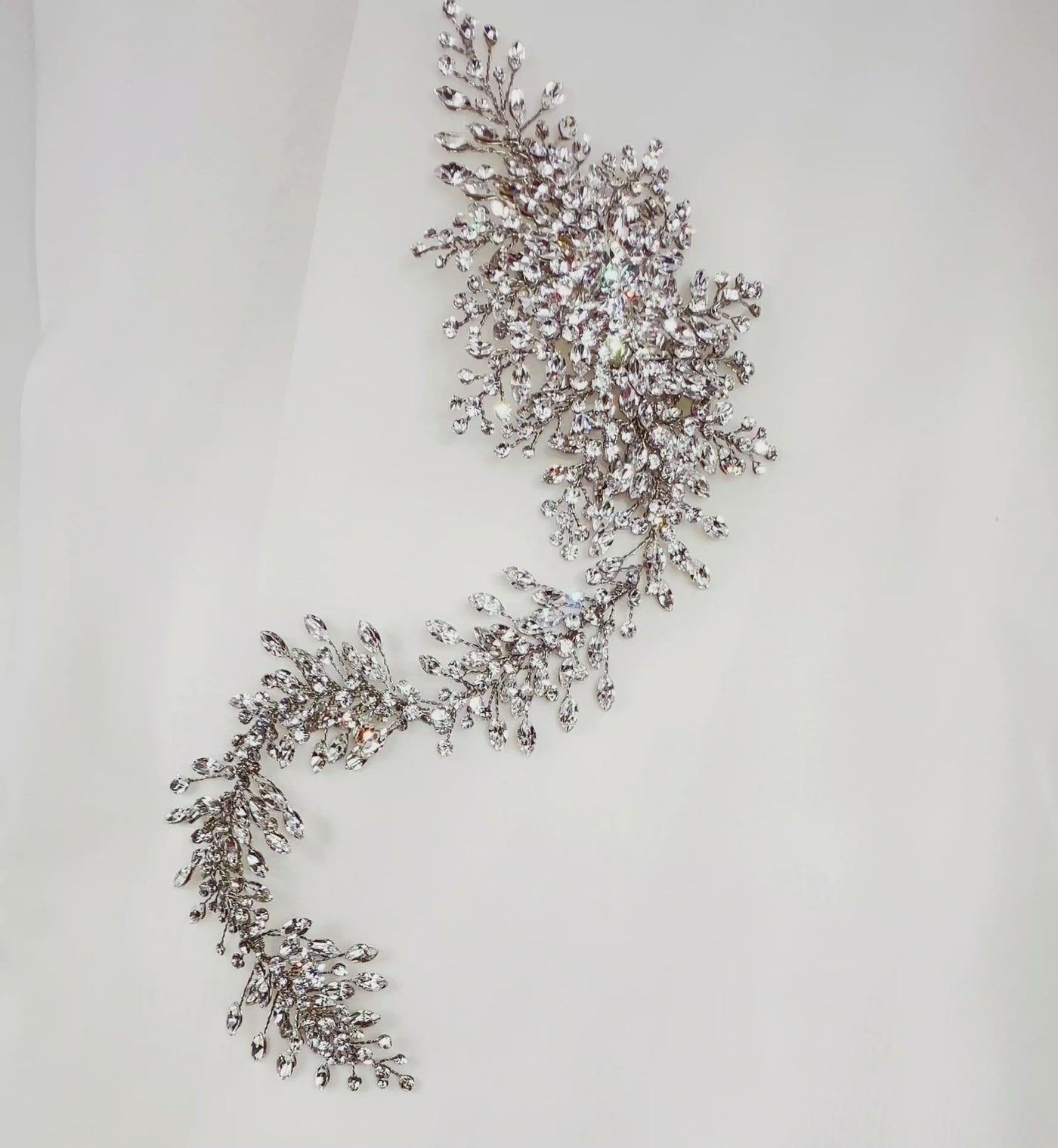 asymmetrical silver bridal hair vine with various sparkling crystals