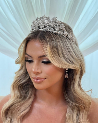 female model wearing silver bridal tiara with crystal and pearl floral clusters
