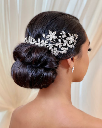 asymmetrical crystalized flower headband with pearls on female model with updo hairstyle