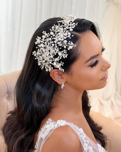 wide end of pearl and crystal bridal hair vine on female model 