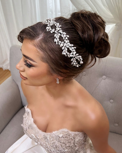 female model wearing looping bridal hair vine with crystals and pearls