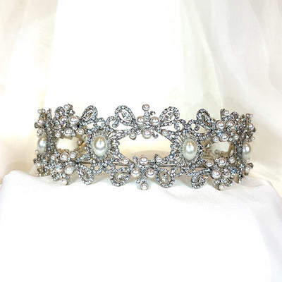 crystal bridal headband with looping silver detailing and pearl accents