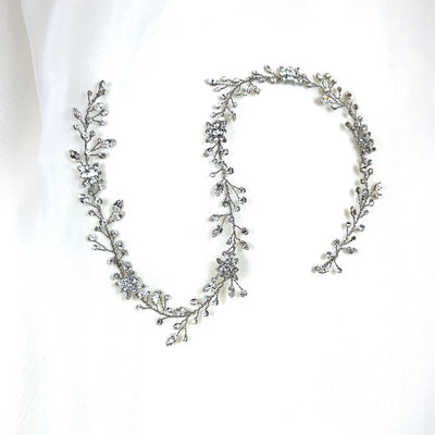 thin silver bridal hair vine with small crystal sprigs and flower details