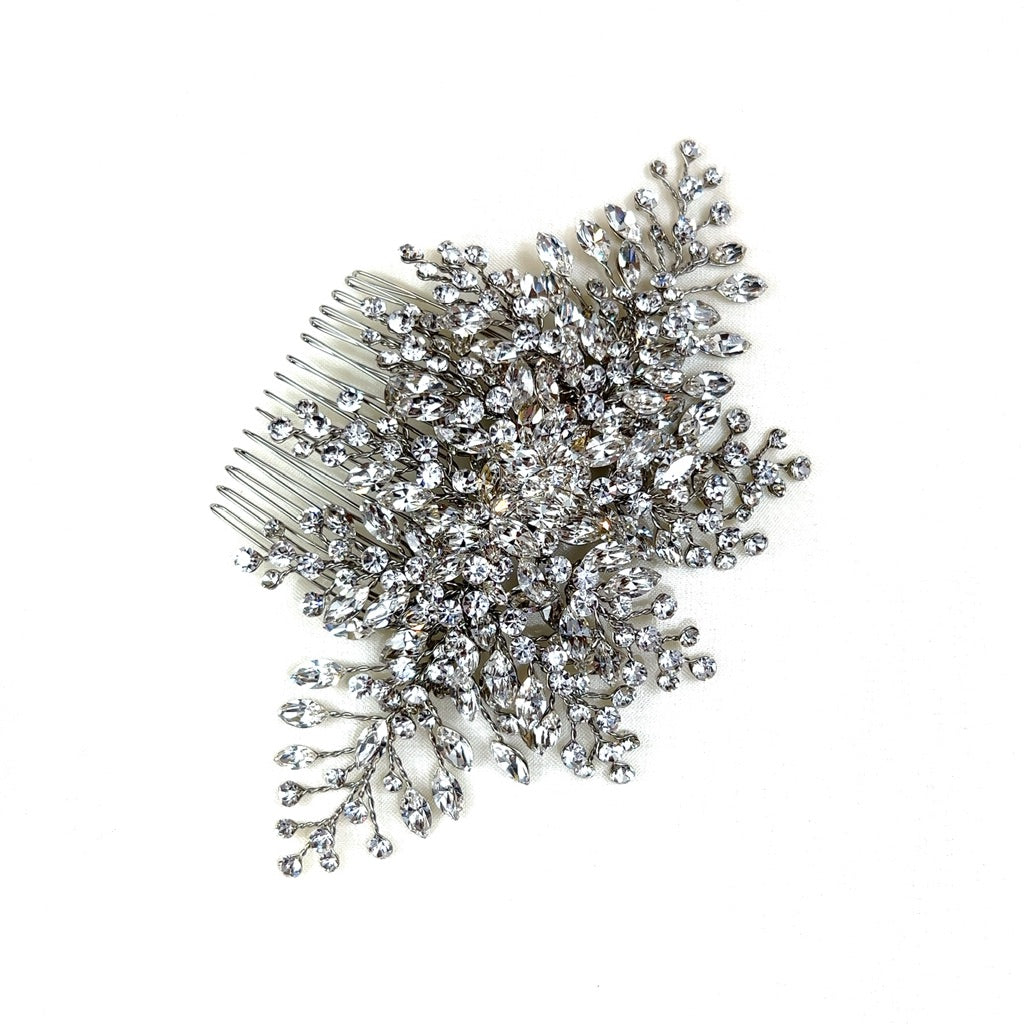 The Soft Crystal Cluster Comb (style no. 242588) is a Swarovski crystal bridal hair accessory featuring intricate sparkling embellishments arranged in a floral and branch-like design on a white background.