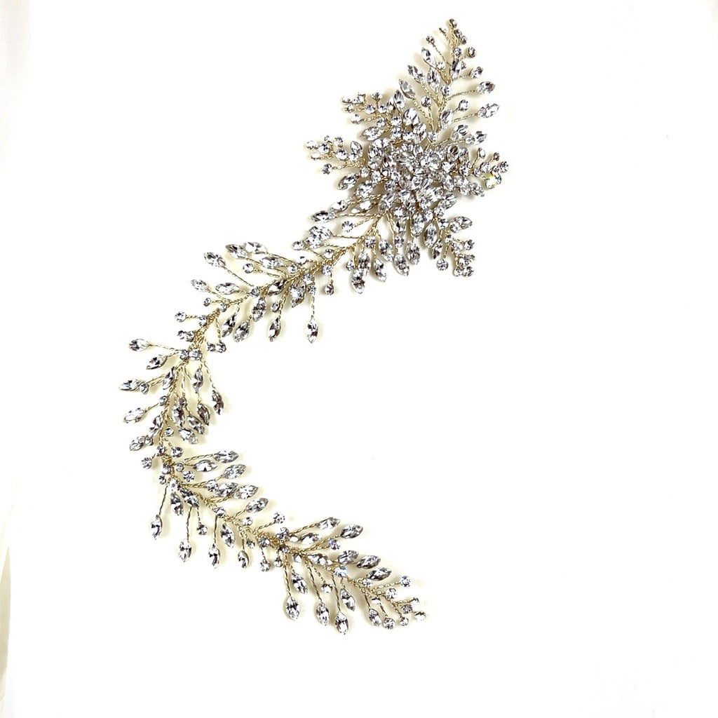 The Romantic Asymmetrical Hair Vine style no. 242552 features a decorative, leaf-like arrangement of sparkling Swarovski crystals set in a curved design set against a plain white background.