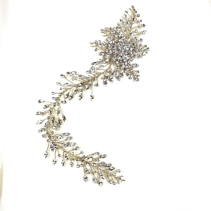 The Romantic Asymmetrical Hair Vine style no. 242552 features a decorative, leaf-like arrangement of sparkling Swarovski crystals set in a curved design set against a plain white background.