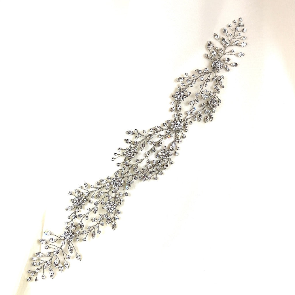 The Delicate Weaving Crystal Hair Vine (style no. 242465) is a Swarovski crystal wedding hair accessory with intricate leaf and branch patterns in an elegant, flowing design. 
