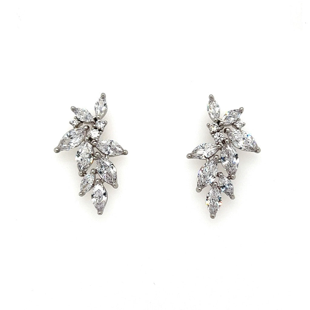 The Delicate Cluster CZ Bridal Earrings (style no. E198) feature elegant, silver-toned marquise-shaped stones in a leaf-like design with a diamond-like sparkle.
