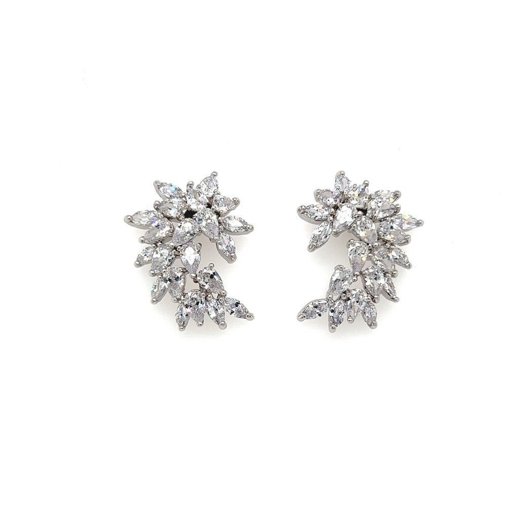 The Timeless Spiral Cluster Wedding Earrings (style no. E196) showcase an intricate design of small CZ gemstones in a floral pattern, echoing the elegance of a Swarovski wedding crown, set against a plain white background.