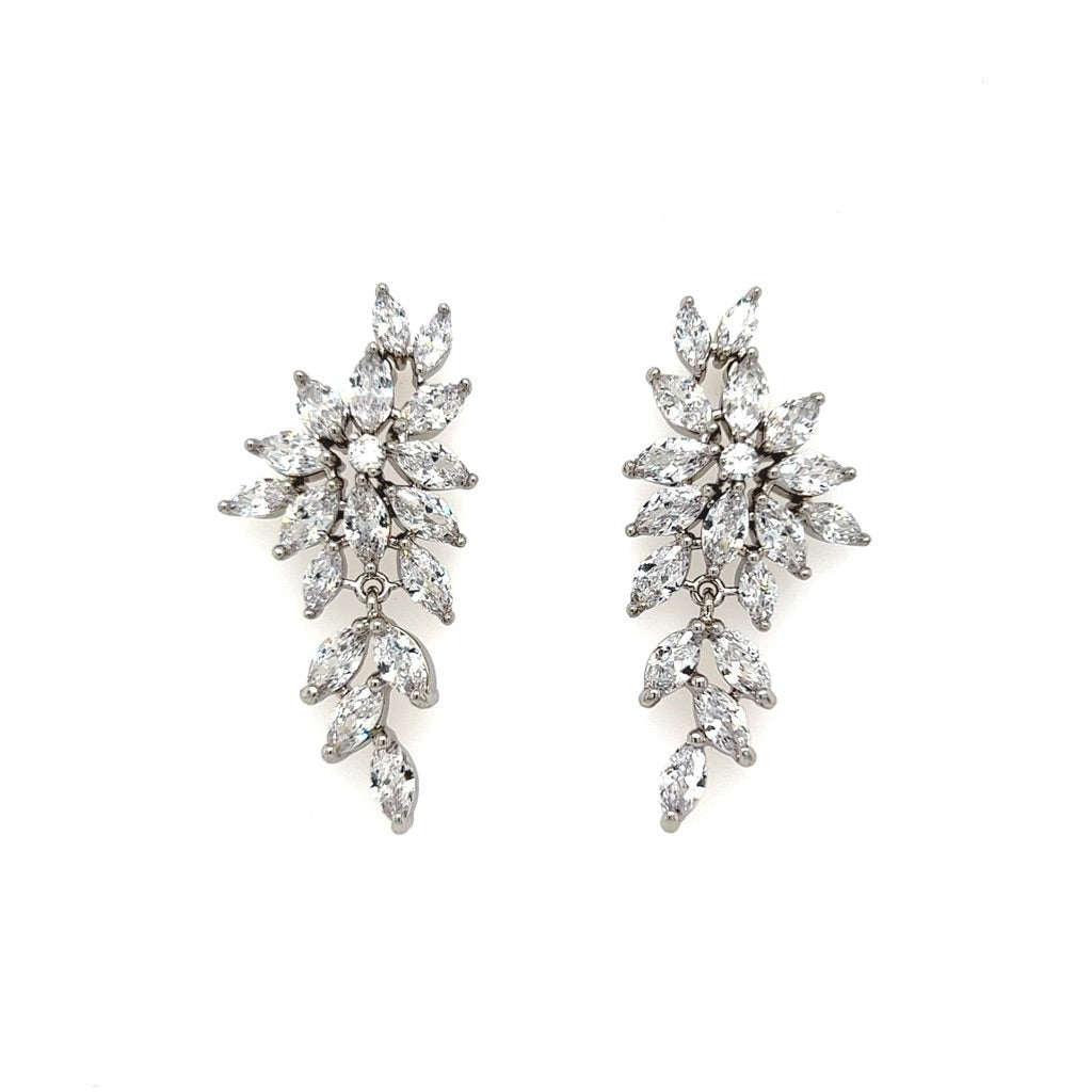 The Cascading CZ Leaf Bridal Earrings (style no. E169) feature marquise-shaped cubic zirconia in a leafy design, making them perfect bridal accessories against a white background.