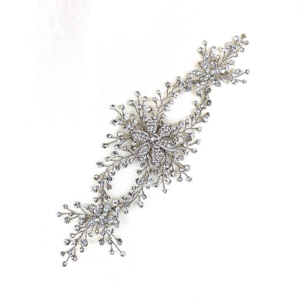 double loop silver bridal hair vine with crystalized flower details and small sprigs of round crystals